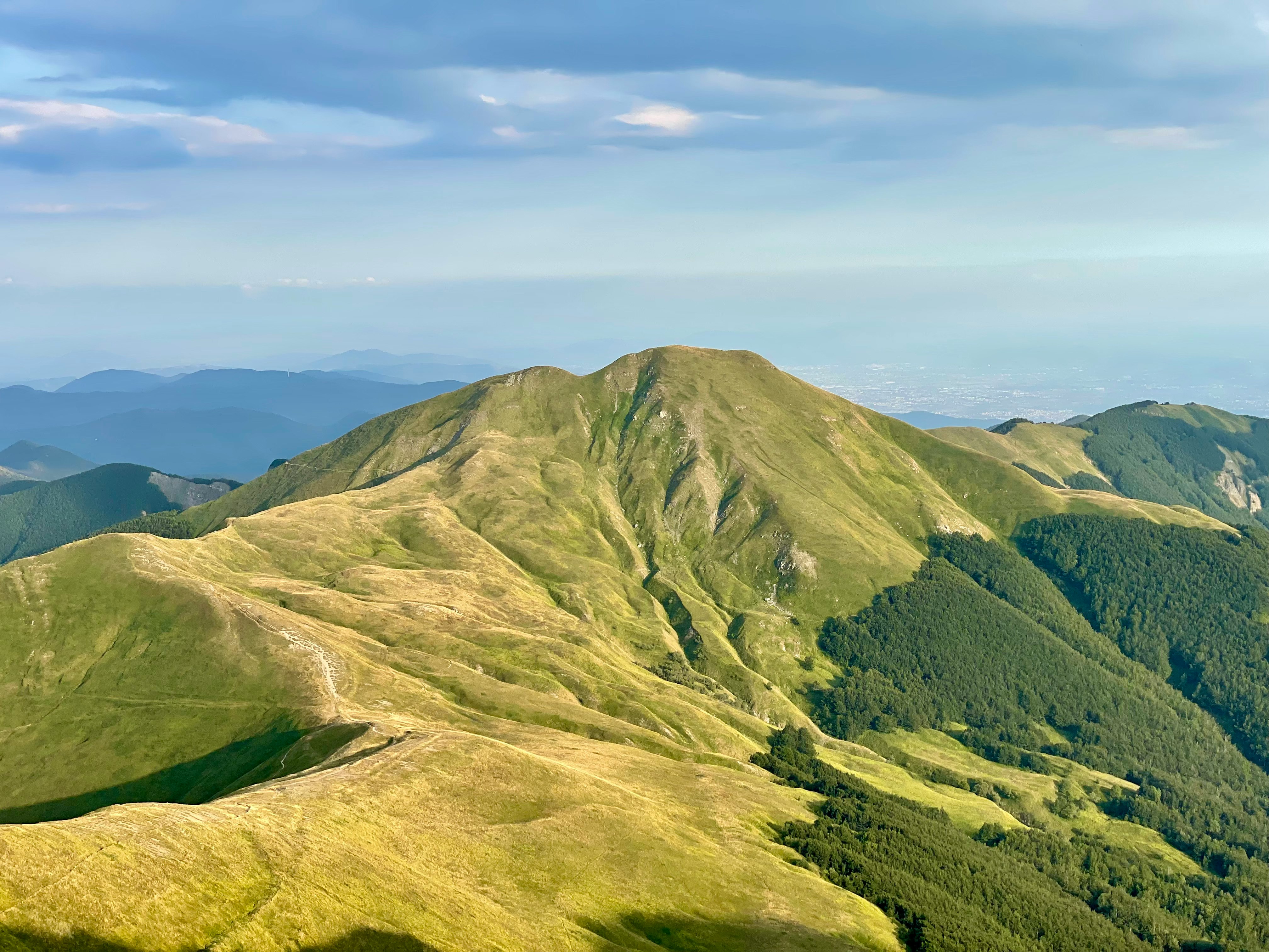 green and brown mountains under white clouds during daytime